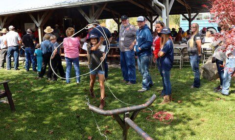 Kids got to practice the correct style of throwing a lariat at the steel steer.