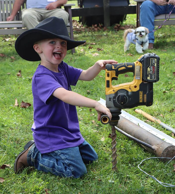 One demonstration was how to drill pilot holes for driving the PVC Lifetime posts and installation.