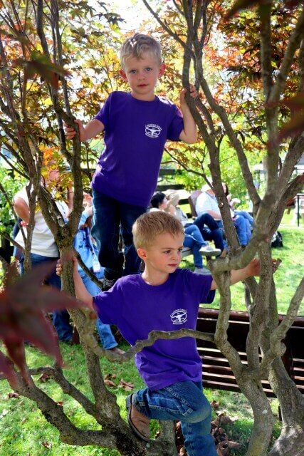 Small loud children could be found in trees, running, eating, spilling food, laughing, making friends and occasionally helping.